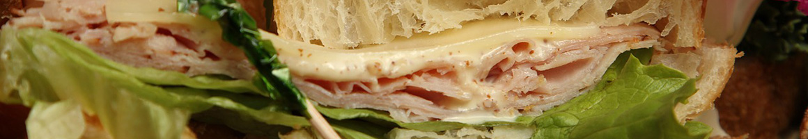 Eating Pizza Sandwich at Kodiak Jax II restaurant in Hamilton, MT.